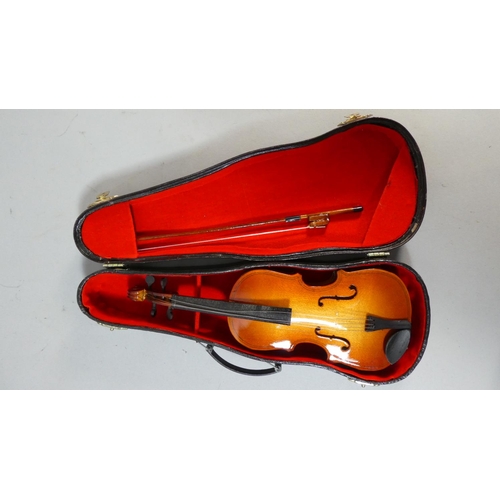 8 - A Cased Model of a Double Bass with Bow and a Cased Model of a Mandolin, 27cm and 20cm Long