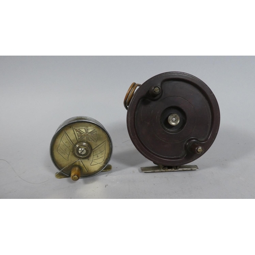 A Vintage Brass Fishing Reel with Flag Decoration together with Larger  Bakelite Example