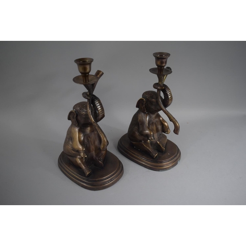 101 - A Pair of Indian Lacquered Bronze Candlesticks on the Form of Seated Elephants. 28cms High