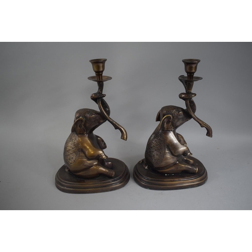 101 - A Pair of Indian Lacquered Bronze Candlesticks on the Form of Seated Elephants. 28cms High