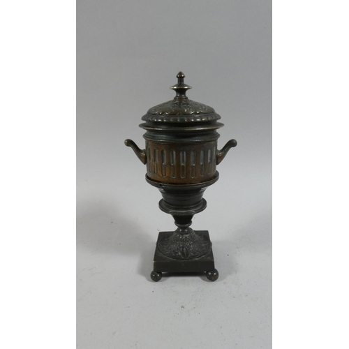 105 - An Early 19th Century Regency Bronze Inkwell in the Form of a Classical Lidded Urn. 18cms High