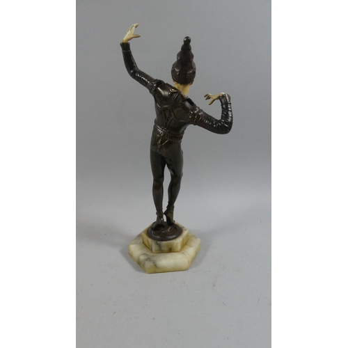 106 - A Mid 20th Century Art Deco Style Bronzed Metal Figure of a Jester with an Ivorine Face and Painted ... 