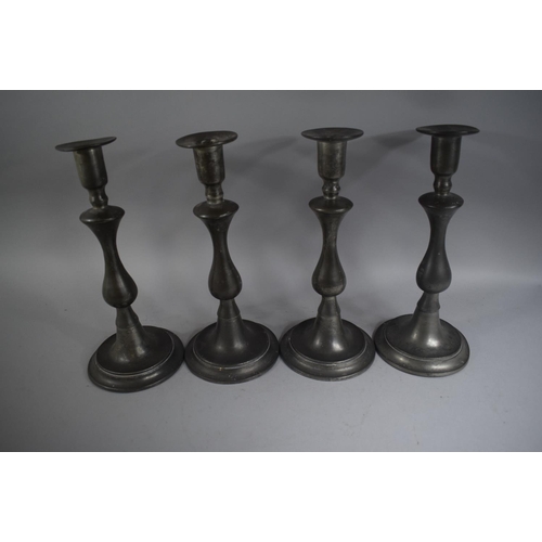 110 - Four Pewter Candlesticks on Stepped Circular Plinth Bases