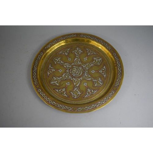 111 - A Mixed Metal Cairo Ware Plate, Brass Inlaid with Copper and White Metal. 24cms Diameter