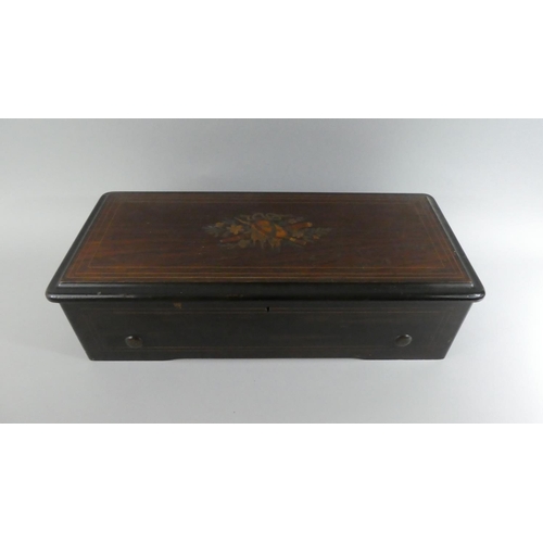 2 - A Swiss Music Box. Eight Airs 'Fabrique De Geneve' Label to Inner Numbered 5567. 52x23x14cms High