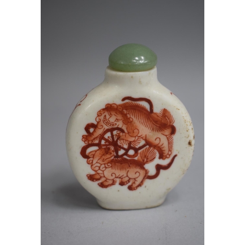 214 - A Chinese Ceramic Snuff Bottle of Flattened Circular Form, decorated with Orange Enamelled Scenes of... 