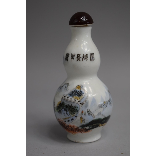 216 - A Chinese Celadon Double Gourd Snuff Bottle decorated with Applied Enamels depicting Farmers Toiling... 