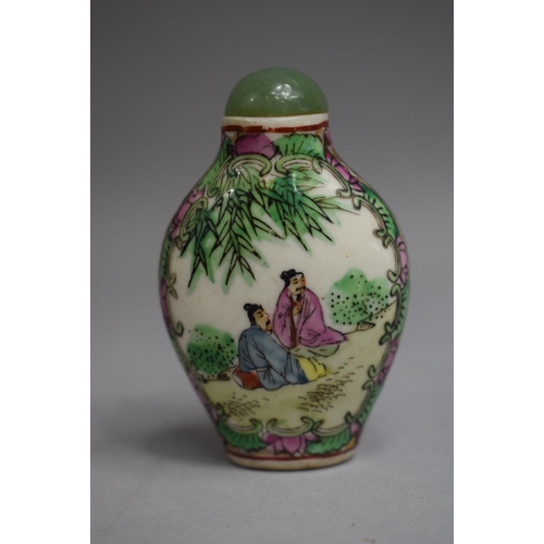 217 - A Chinese Ceramic Snuff Bottle of Rounded Rectangular Form decorated in Famille Rose Enamels with Ce... 