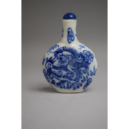 219 - A Chinese Porcelain Blue and White Snuff Bottle of Flattened Oval Form with Cylindrical Elongated Ne... 