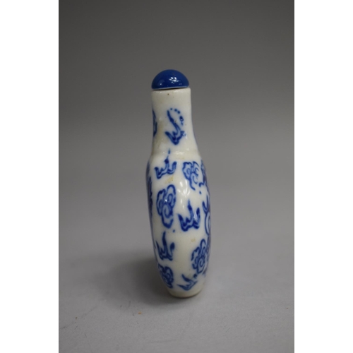 219 - A Chinese Porcelain Blue and White Snuff Bottle of Flattened Oval Form with Cylindrical Elongated Ne... 