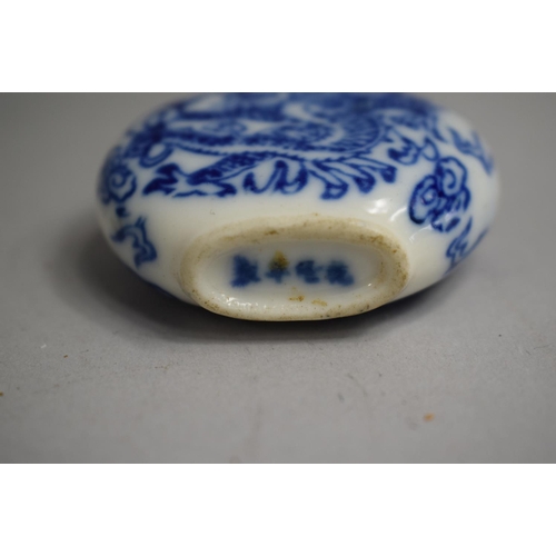 219 - A Chinese Porcelain Blue and White Snuff Bottle of Flattened Oval Form with Cylindrical Elongated Ne... 