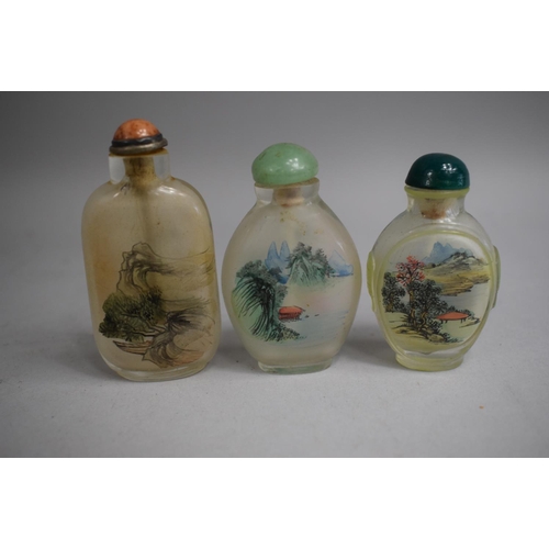 226 - A Collection of Three Chinese Reverse Painted Snuff Bottles, One of Rectangular Form decorated with ... 