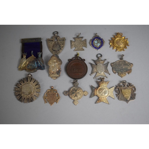 252 - A Collection of 14 Various Sporting Medals including Five Silver Examples.