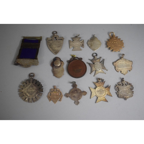 252 - A Collection of 14 Various Sporting Medals including Five Silver Examples.