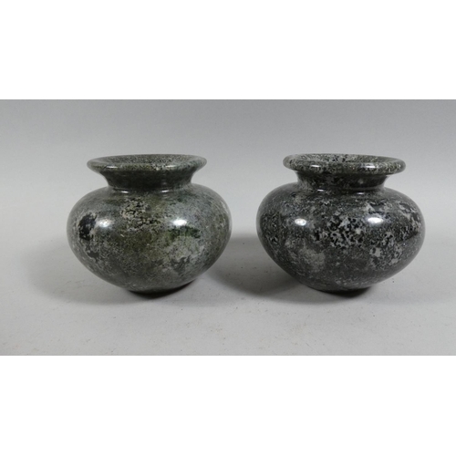 255 - A Pair of Variegated Green Marble Urns. 11cms Diameter