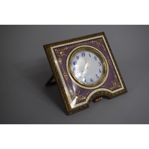 257 - A Pretty Enamelled and Gilt Decorated Travel Clock with Hinged Easel Stand. 8cms Square, Movement Re... 