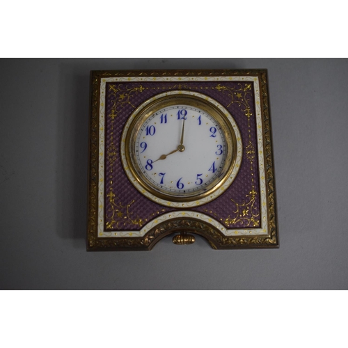 257 - A Pretty Enamelled and Gilt Decorated Travel Clock with Hinged Easel Stand. 8cms Square, Movement Re... 