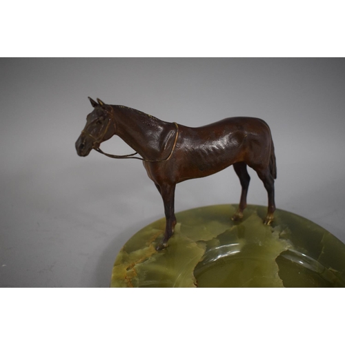 258 - A Cold Painted Bronze Study of a Race Horse on Green Onyx Ashtray Base in the form of a Horseshoe