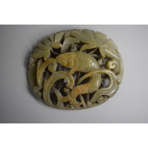 274 - A Nice Quality Carved and Pierced Jade Amulet depicting Fish in Reeds. 8x6.5cms