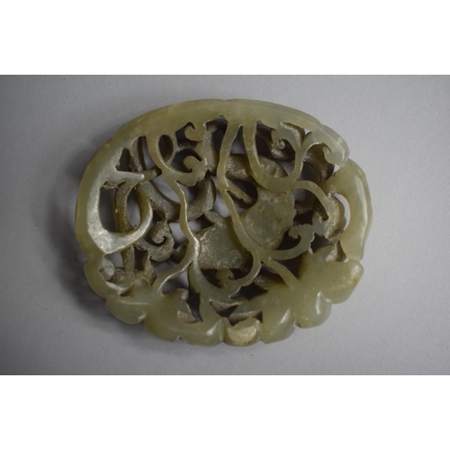 274 - A Nice Quality Carved and Pierced Jade Amulet depicting Fish in Reeds. 8x6.5cms