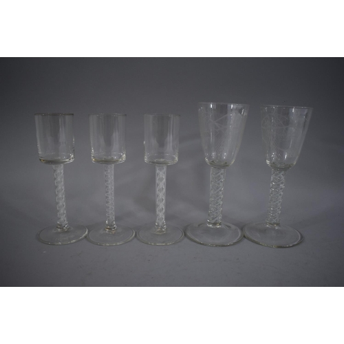 319 - A Collection of Five Double Air Twist Ale Glasses. The Pair with Barley Engraving to Bowls