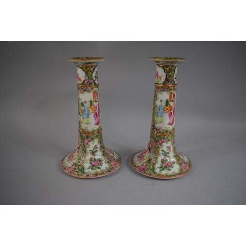 375 - A Pair of Cantonese Candlesticks decorated in Usual Colour Enamels depicting Figures Birds and Flowe... 