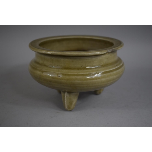 377 - An Oriental Glazed Censer on Three Feet, Chip to Rim, 14.5cms Diameter