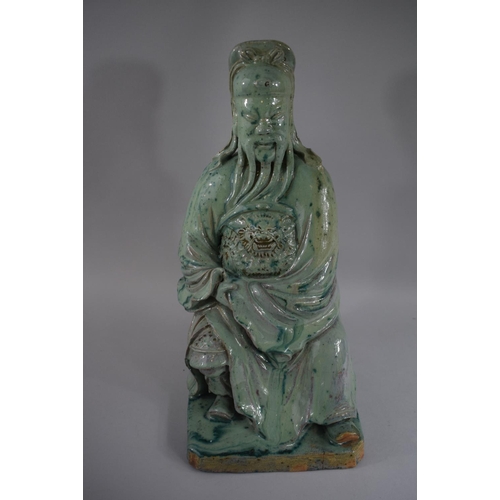 379 - An Early Glazed Chinese Stoneware Figure of Seated Immortal Wearing Robe with Lion Mask Decoration i... 