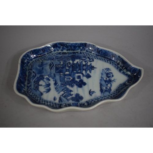 385 - A Set of Four Chinese Blue and White Sauce Boats on Trays decorated with Pagodas and Willow Trees.