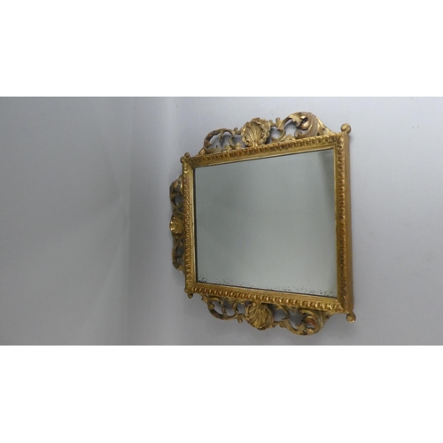 391 - A 19th Century Italian Florentine Carved and Gilded Wall Mirror with a Pierced Rococo Frame. 41x41cm... 