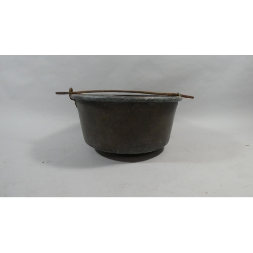 416 - A 19th Century Copper Vat with an Iron Carrying Handle. 54cms Diameter