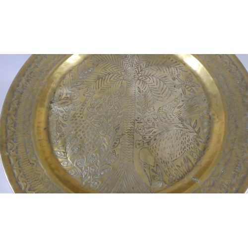 432 - An African Circular Brass Marriage Table with Folding Stand decorated in Relief with Coconut Palm, G... 