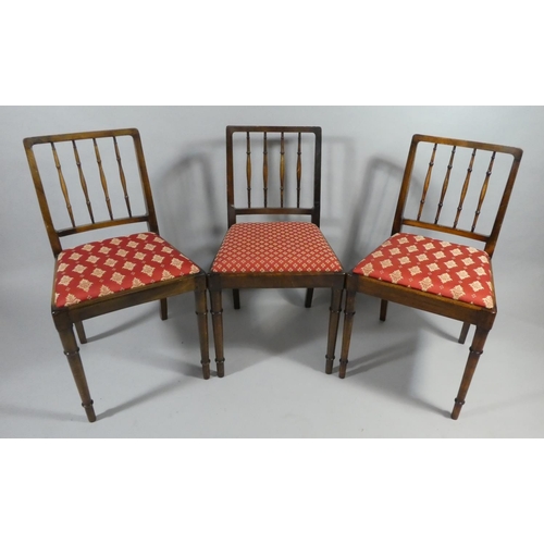 437 - A Set of Eight Spindle Back Dining Chairs by Gomme