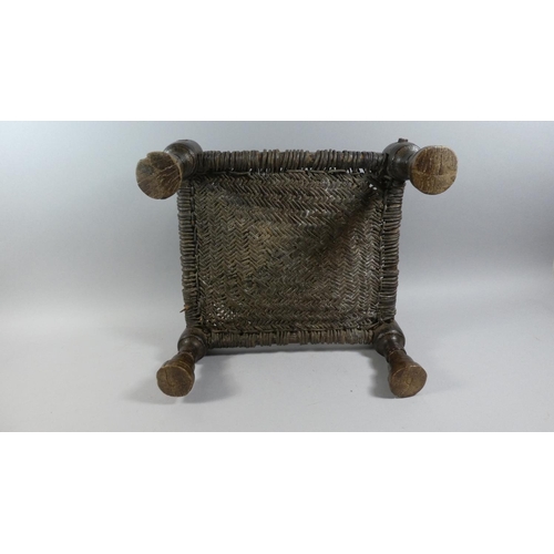 70 - A 19th Century Indian Carved Wooden Stool with a Woven Leather Seat. 42x40x20cms