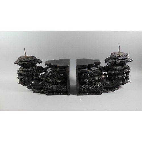 71 - A Pair of 19th Century Indian Carved Wood and Ebonised Candle Sconce Brackets. 36x15x32cms