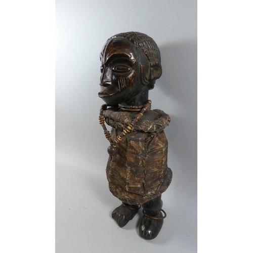 72 - An Impressive Early 20th Century Wooden African Male Figure with well Patinated Carved Detail. Weari... 