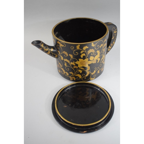 73 - A Good Japanese Lacquer Teapot with Gilt Floriate Decoration of Circular Form on Three Feet. 19cms H... 