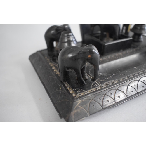 126 - A Mid/Late 20th Century Colonial Ebonised Desk Tidy with Elephant Finials (AF) (22cms Wide x 15cms H... 