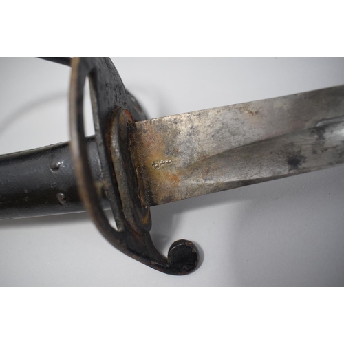 83 - A 19th Century Sword and Metal Scabbard. The Blade Engraved Enfield E6 with Crown.