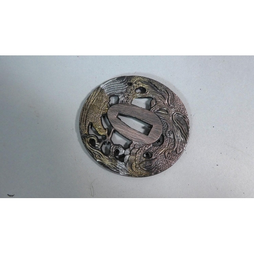 230 - A Japanese Tsuba with Phoenix Decoration and Gilt Highlights, 7cm