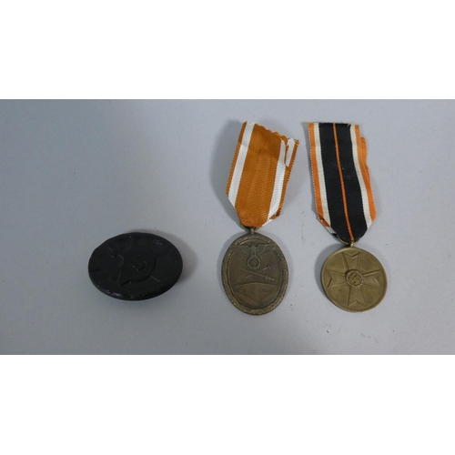 239 - A Collection of WWII Nazi Ephemera, Wound Badge, West Wall Medal and War Merit Medal.