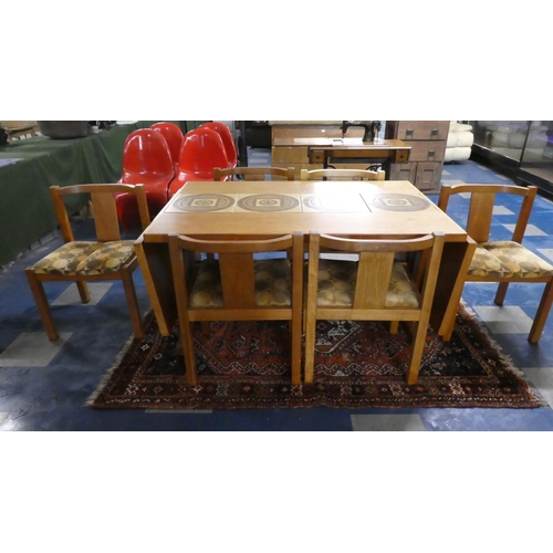 364 - A 1970s Danish Gangso Mobler Tile Topped Dining Table with Drop Leaves together with Six Dining Chai... 