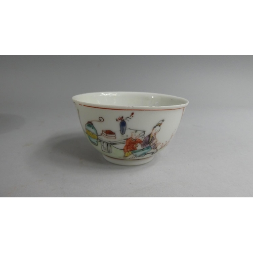 372 - A Chinese Tea Bowl and Saucer decorated with Family Scenes, Interior and Garden.