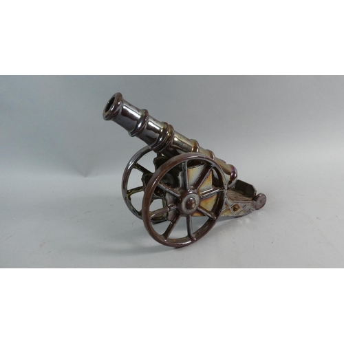 15 - An Enamelled Metal Model of a WWI Howitzer, 21.5cms High