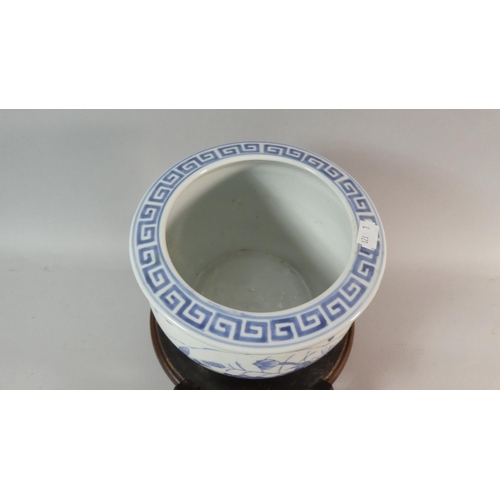 51 - A 20th Century Carved Wooden Chinese Stand Together with Unrelated Blue and White Bowl