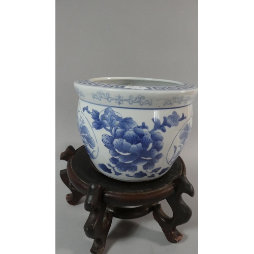 51 - A 20th Century Carved Wooden Chinese Stand Together with Unrelated Blue and White Bowl