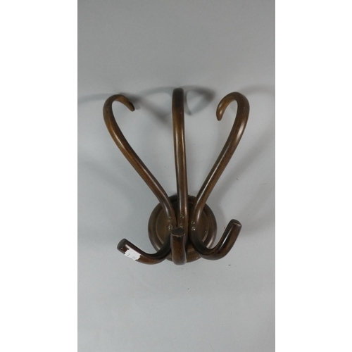 60 - An Edwardian Bentwood Three Section Hat and Coat Hook, 33cm high