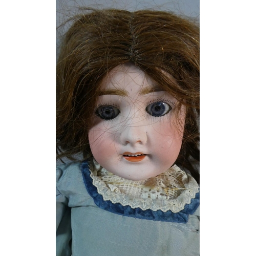 37 - A French 19th Century Bisque Head Doll with Sleeping Eyes, Open Mouth, Painted Lashes and Brows and ... 