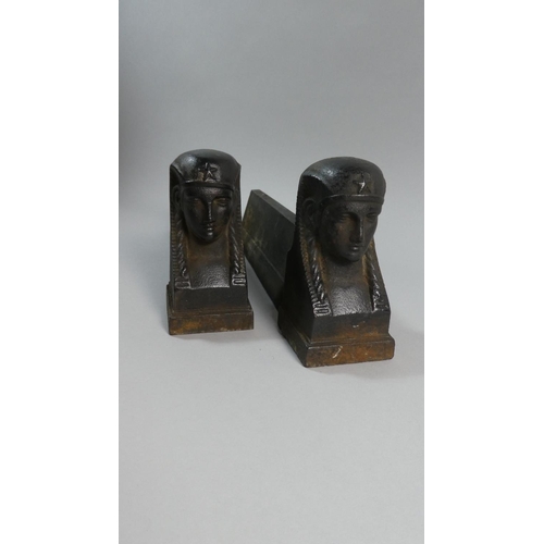 63 - A Pair of 19th Century French Cast Iron Fire Dogs Modelled as Sphinx Heads. 34cms Long