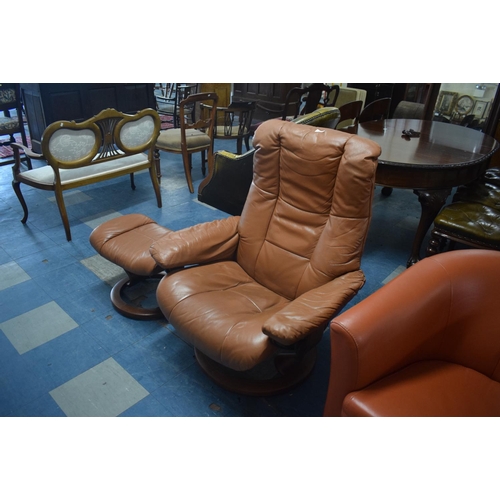 406 - A Late 20th Century Swivel Reclining Leather Armchair and Matching Footstool